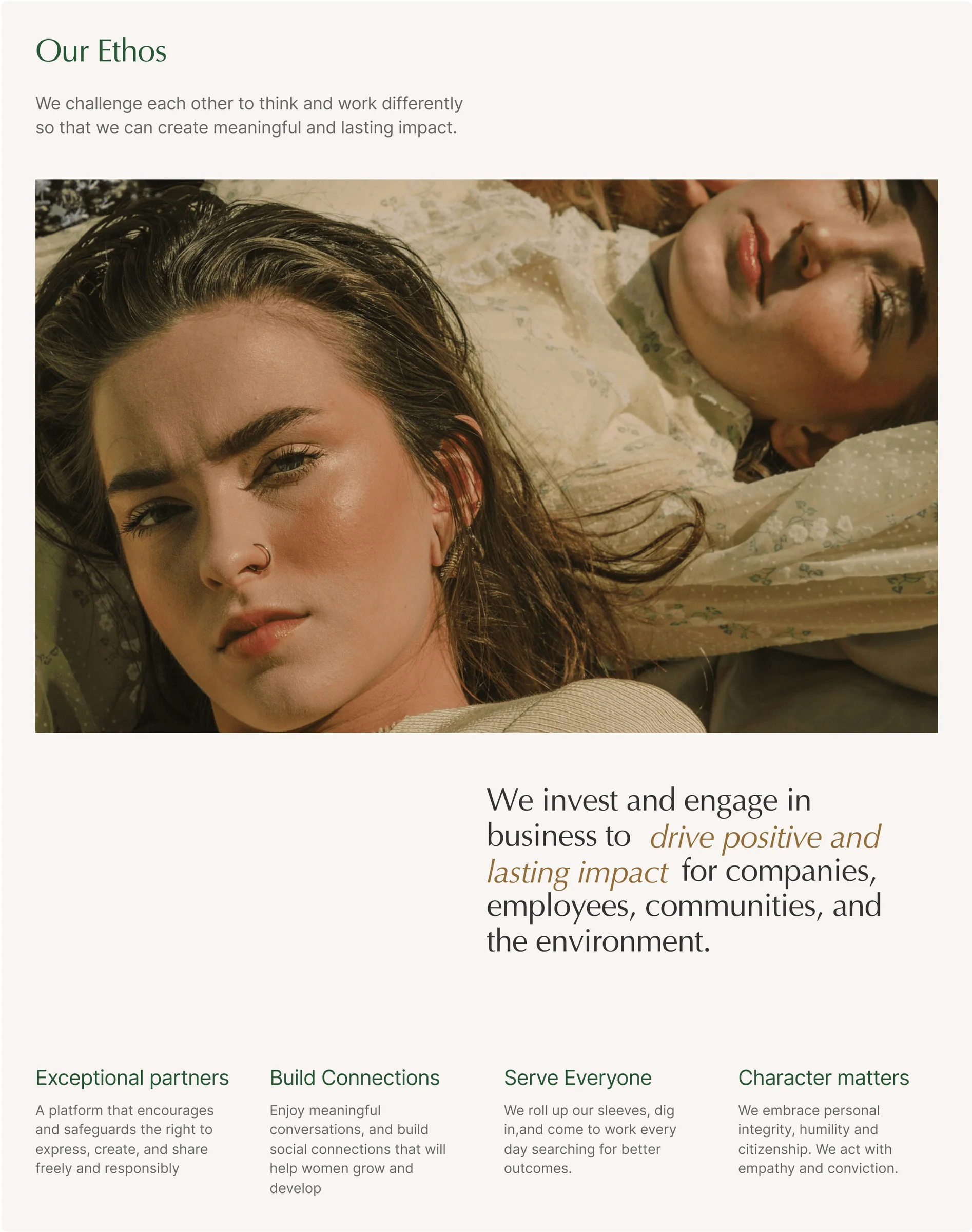 A close-up of two people lying down, one looking contemplative and the other smiling softly.