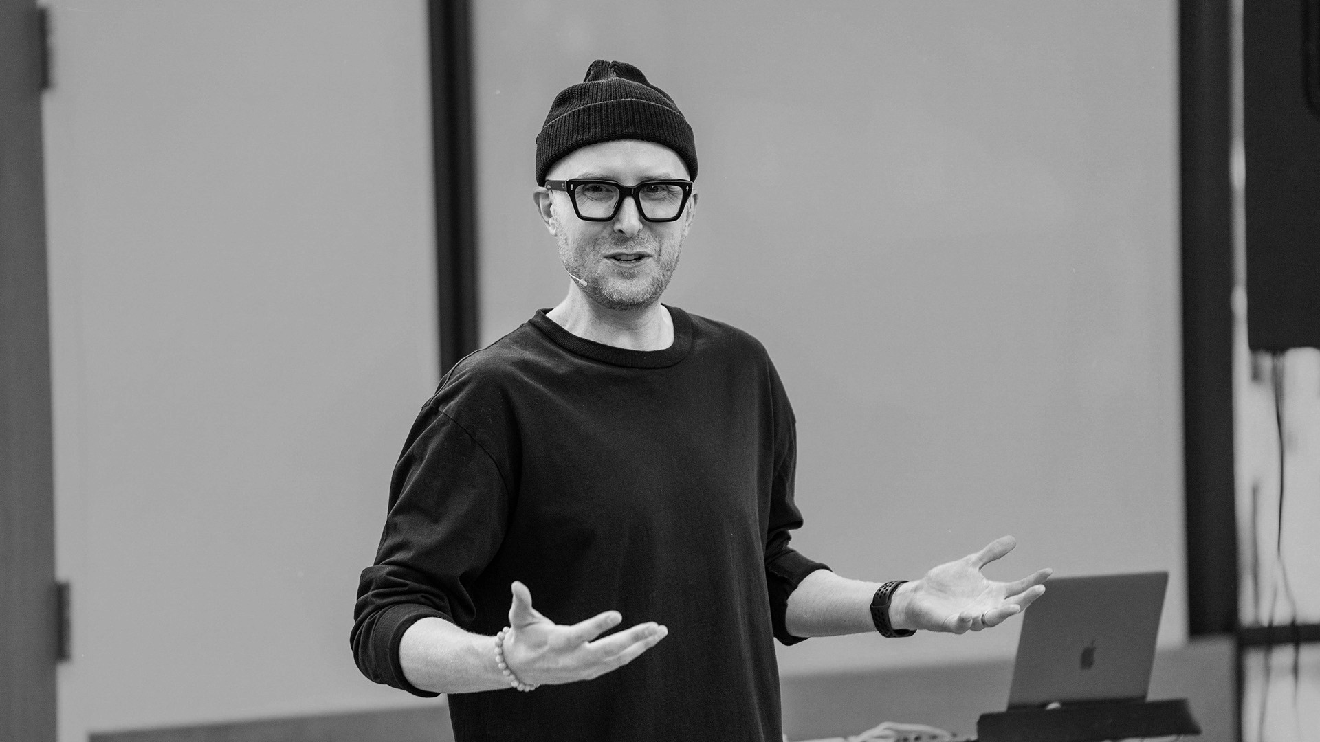 two people looking at a tablet and smiling