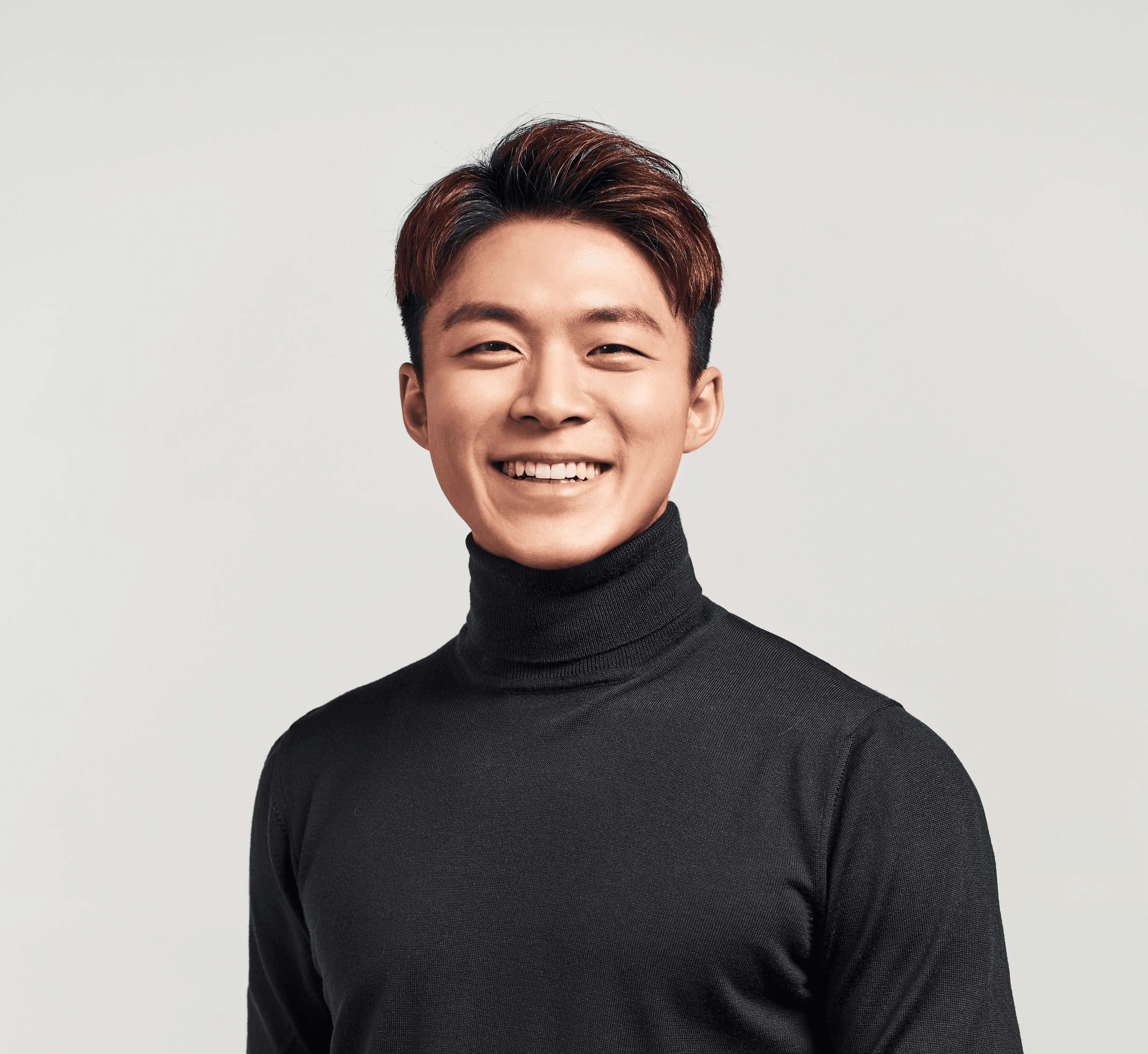 Scientist looking through a microscope in a lab.