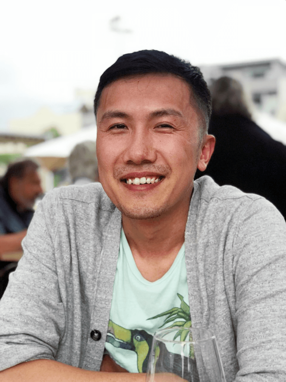 A young man riding a bicycle