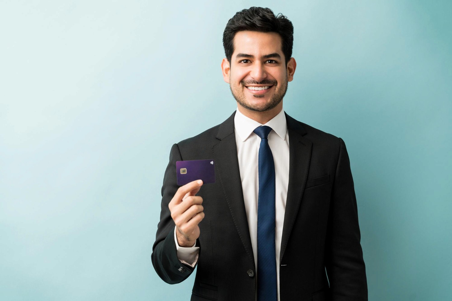 Businessman holding credit card