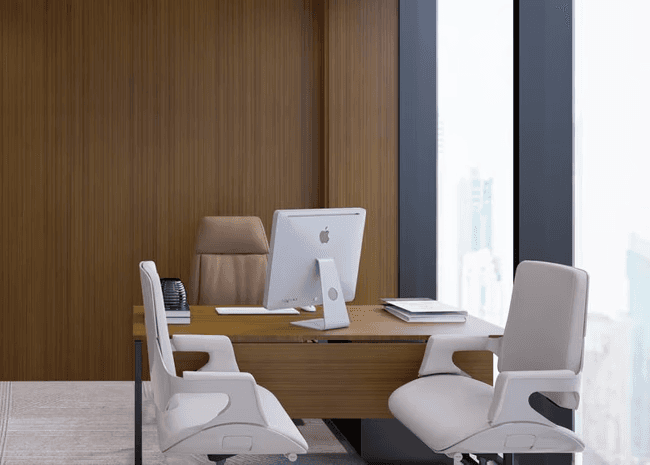 Private 4-seater meeting room with contemporary artwork and leather chairs for executive discussions.