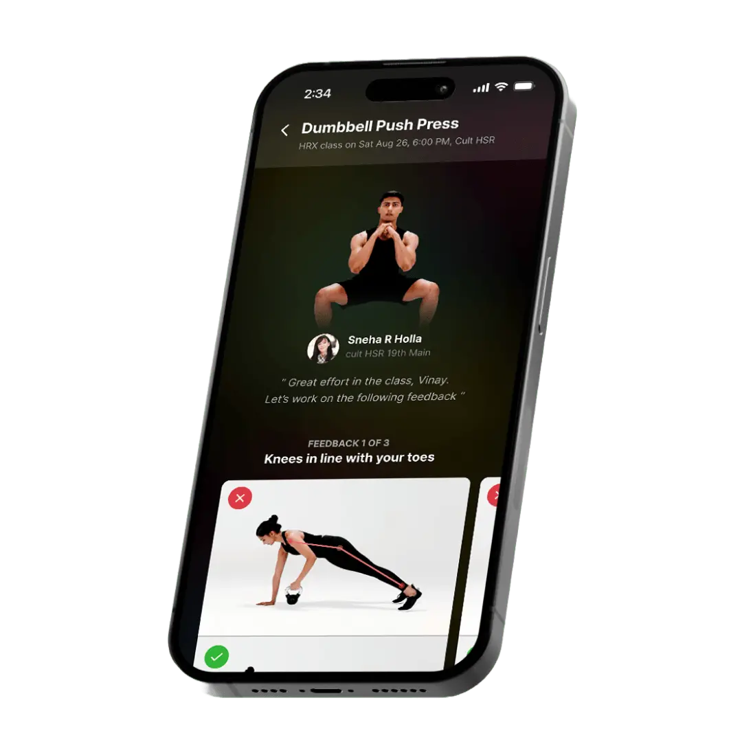 Mobile screen showcasing detailed feedback on a ‘Dumbbell Push Press’ exercise, with trainer comments and visual guidance for improving form.