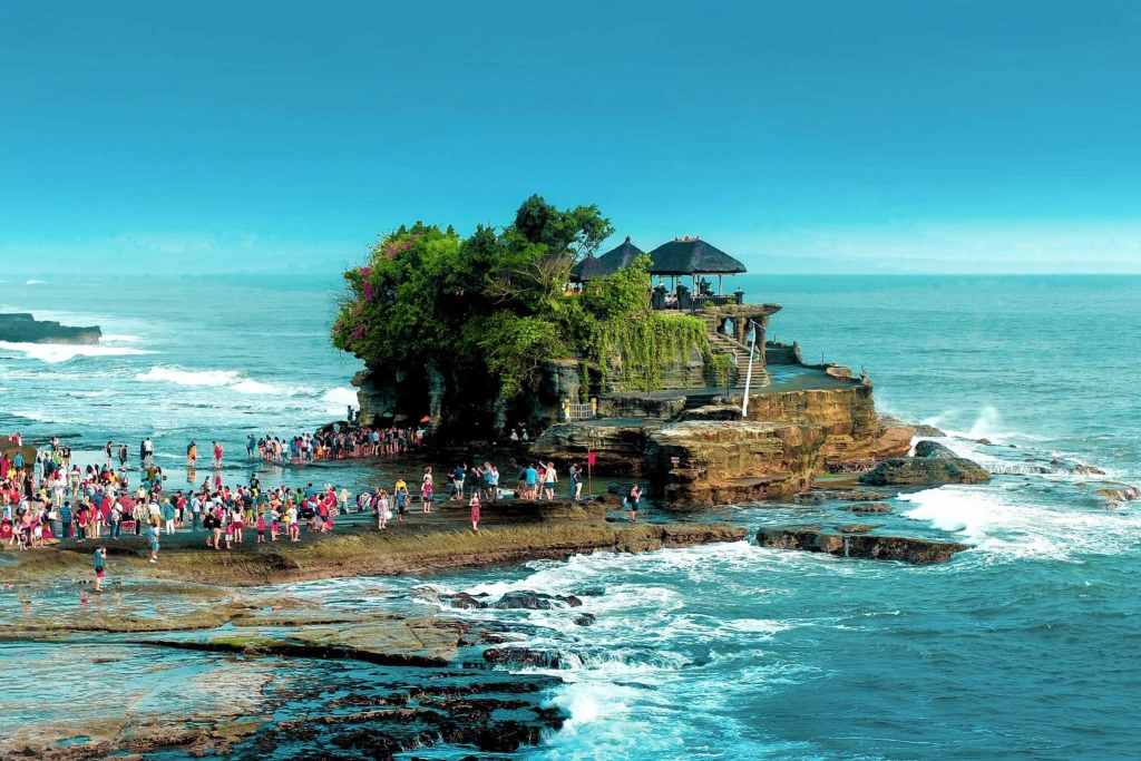tanah lot temple surrounded by the ocean