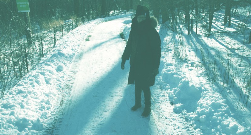 woman with coat on snow
