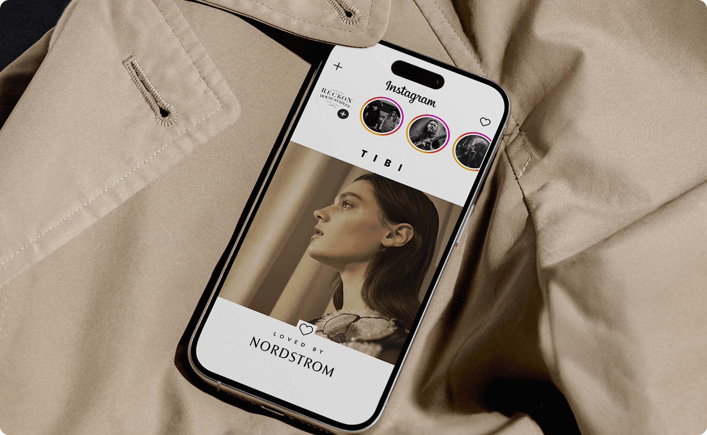 Hill country living room with cognac leather sofa, exposed wood beams, and open concept kitchen with sage green cabinets