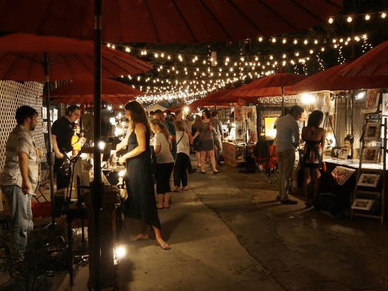 Crowd of people wandering through and shopping at the French Market in the Marigny in New Orleans