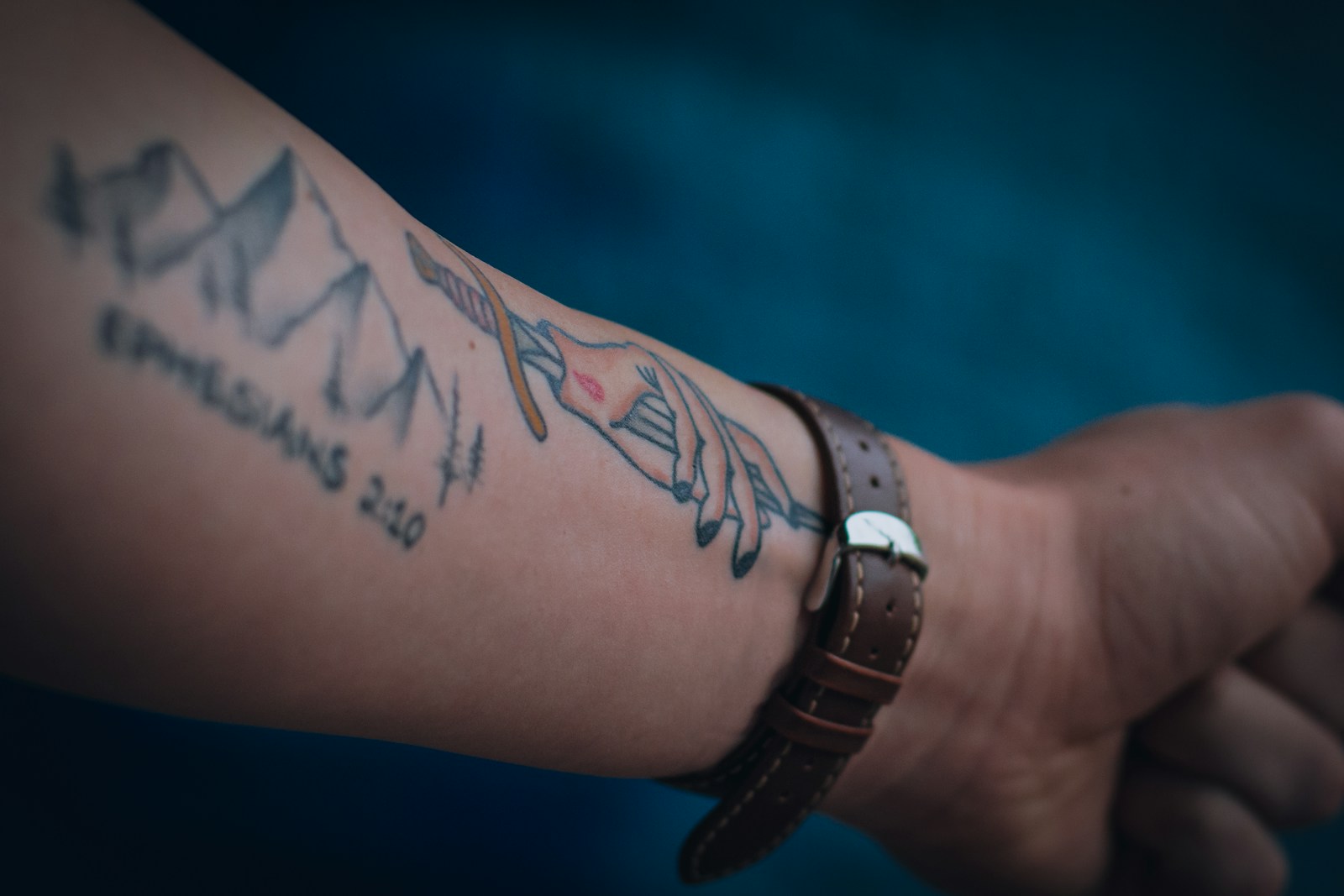Close-up of a tattooed arm before laser tattoo removal treatment