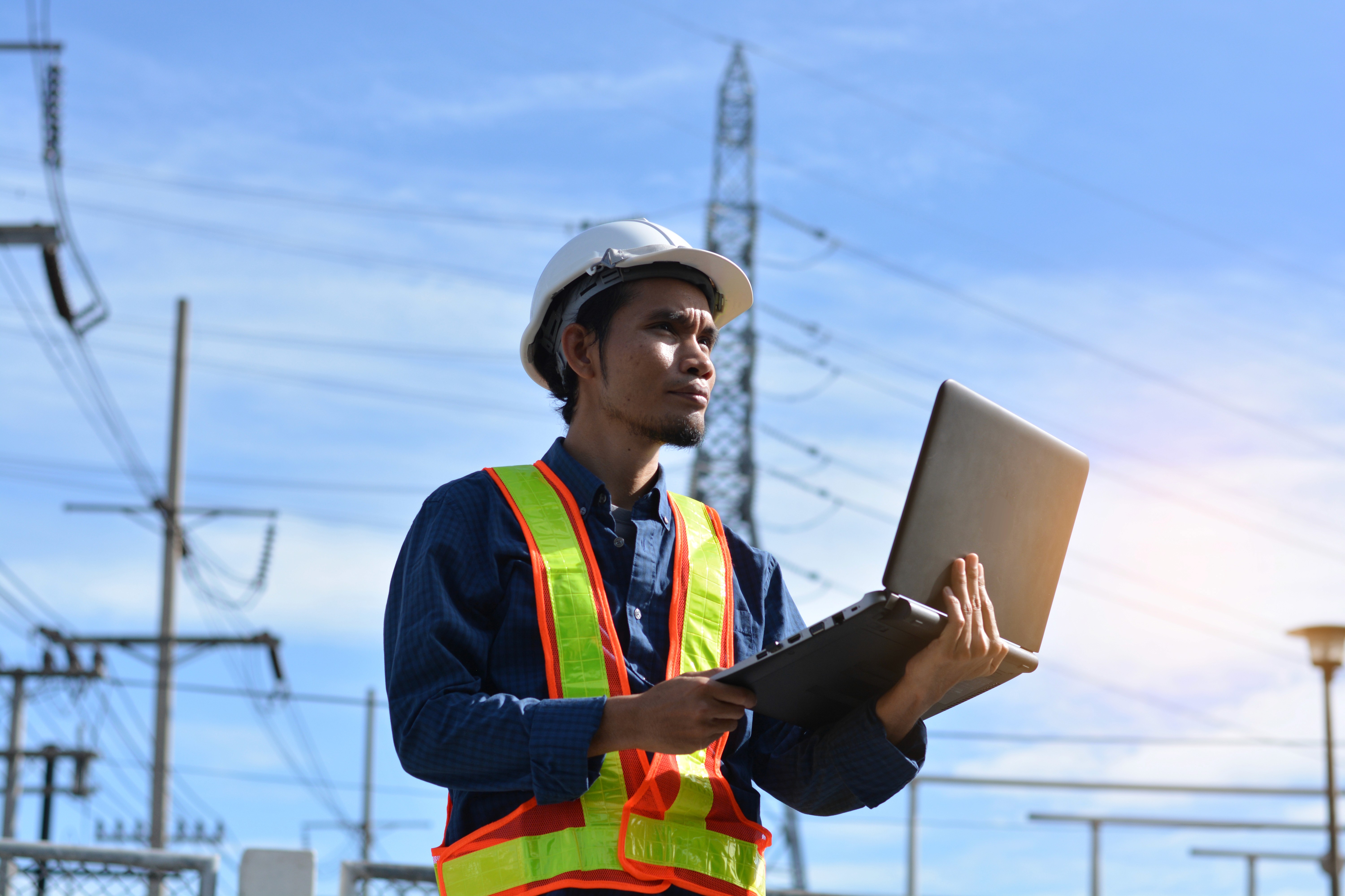 man pouring cements on road