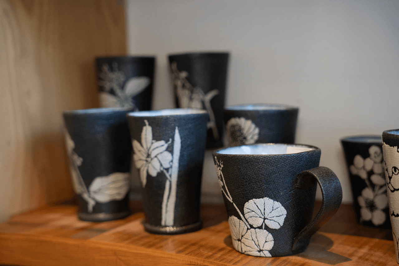 Pottery mugs with flower patterns