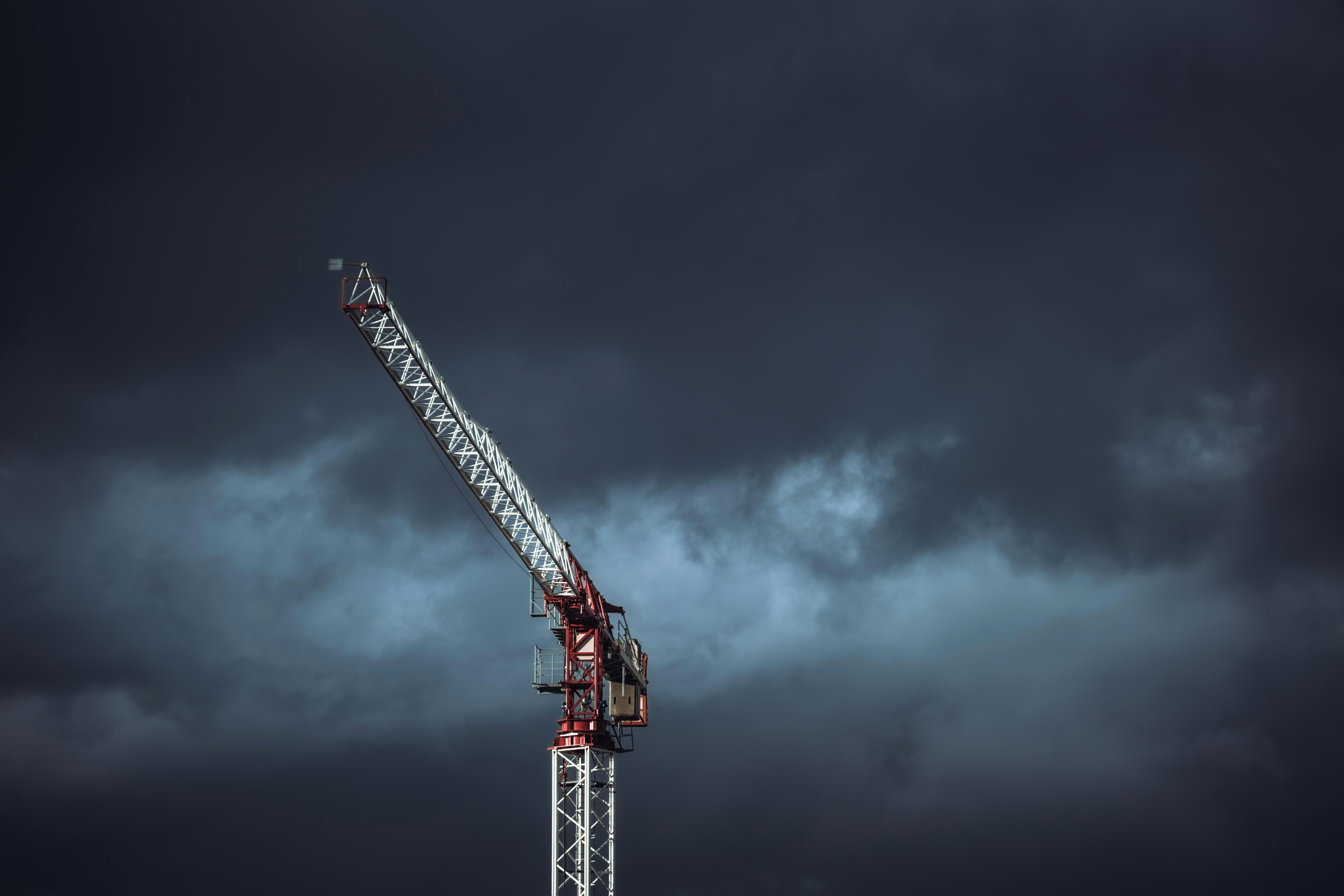 Person wearing orange sunglasses with dramatic orange and red lighting effects creating an artistic portrait