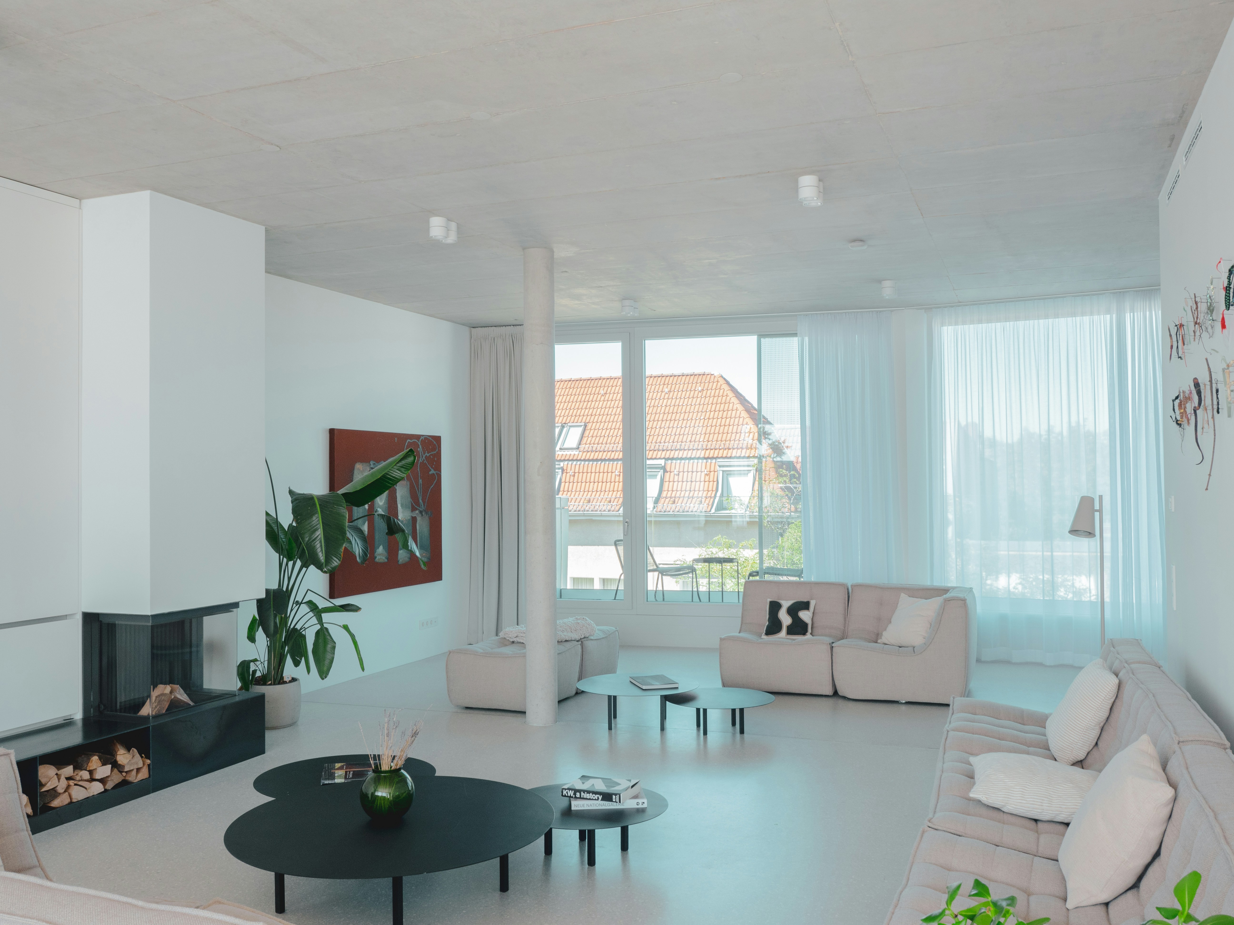 A living room filled with furniture and a fire place