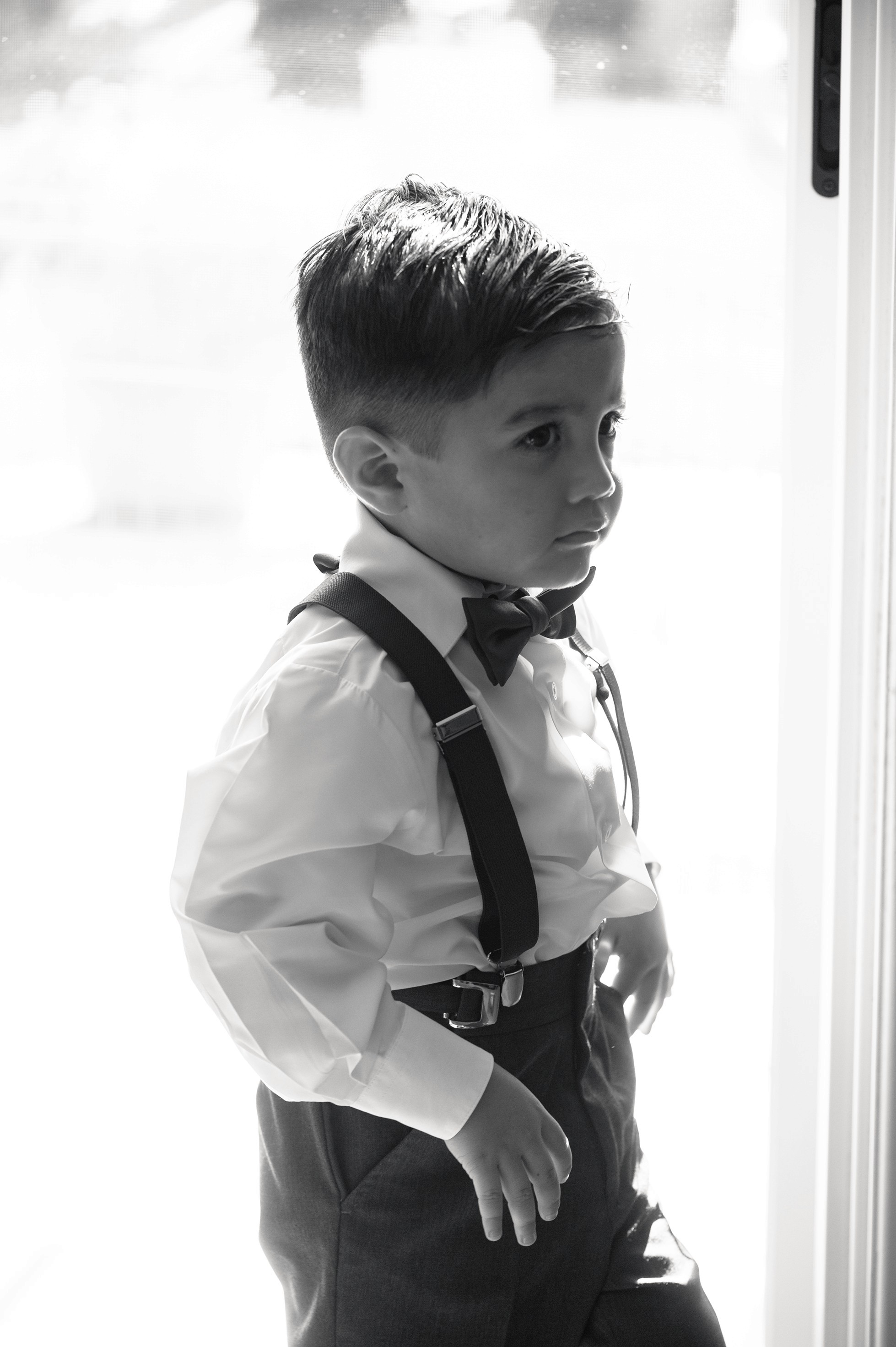 Flat lay wedding details with bouquet, rings, and sparkling bridal heels