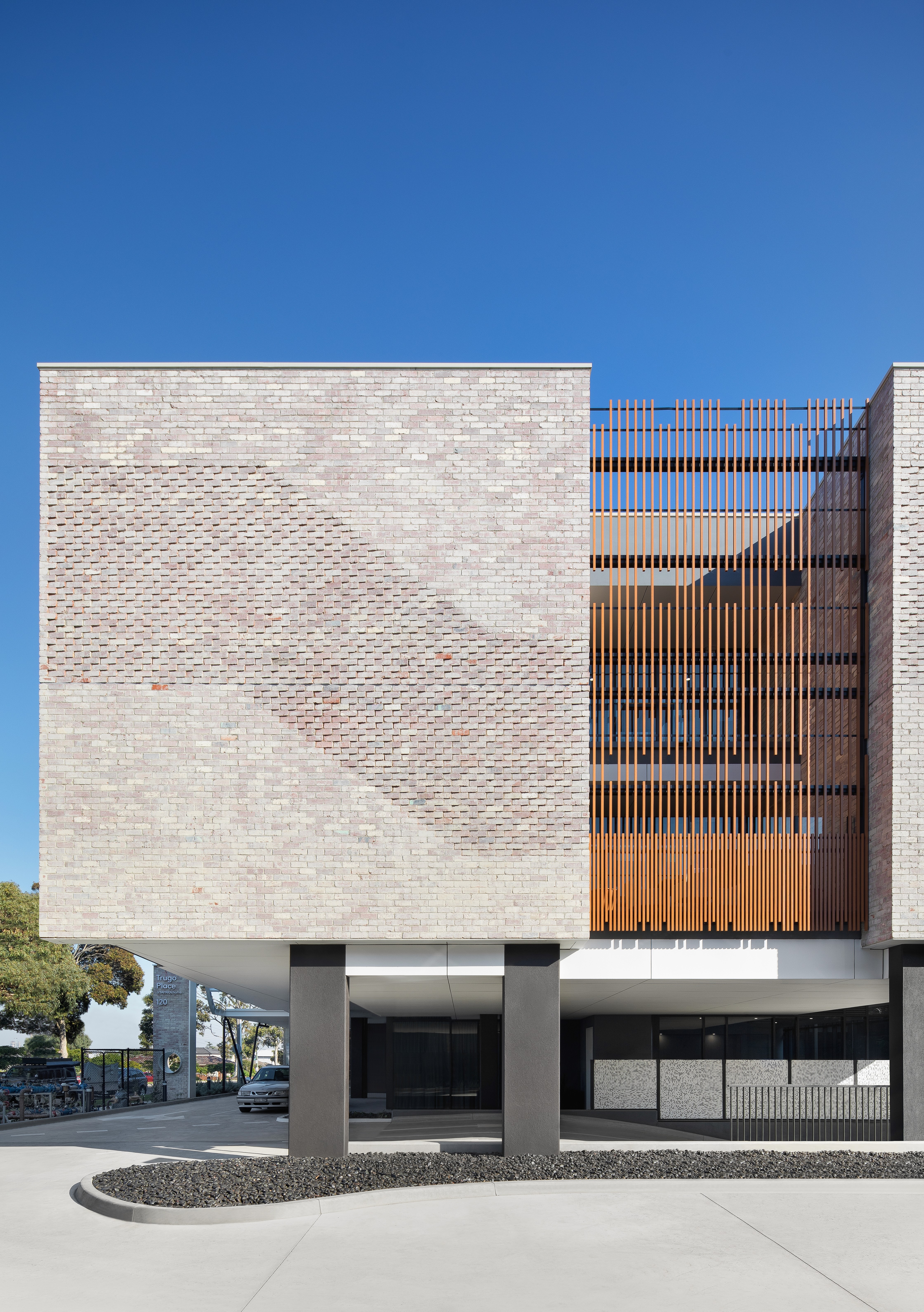 Geometric wooden wall panels with angled shapes and warm highlights.