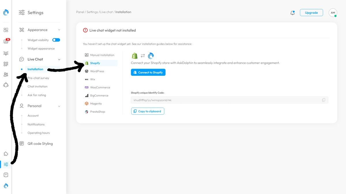 AskDolphin Shopify installation panel showing the Installation tab selected under Live Chat settings with arrows pointing to the Shopify integration option.