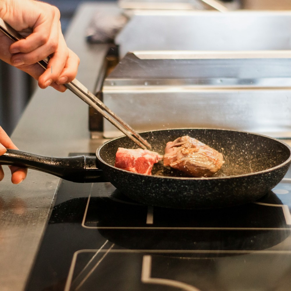 Sizzling food in a pan