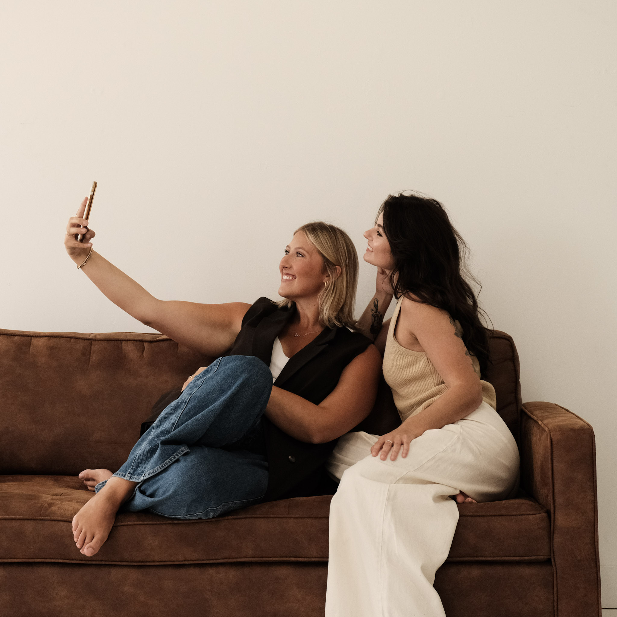 Co-founders of Common Thread branding studio collaborating and laughing together