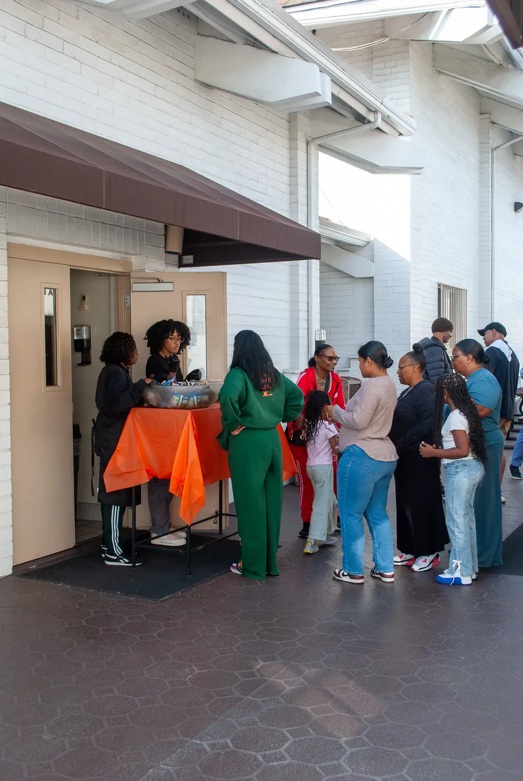 People standing in line outside to receive food during a fellowship event at Peace Apostolic Church.