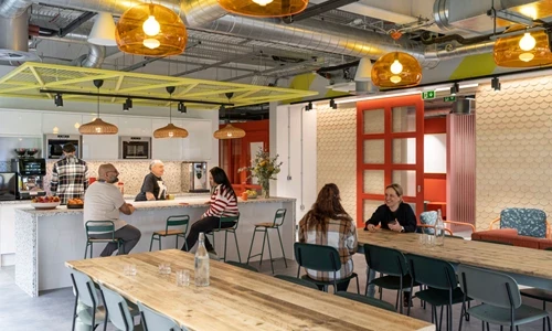 Photo of Opencast employees enjoying the social space in the Newcastle HQ