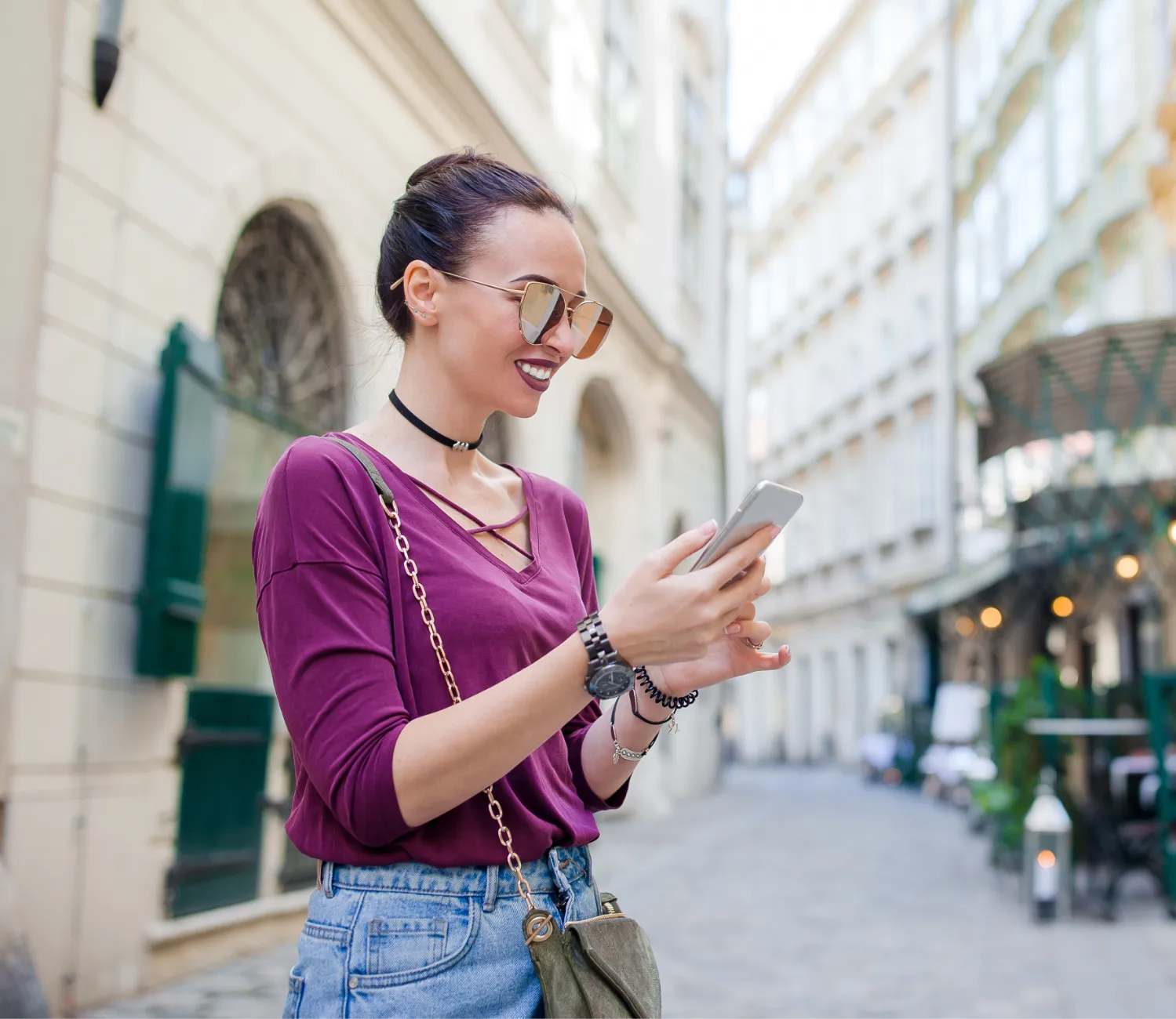 Female Traveller using her phone while in the city