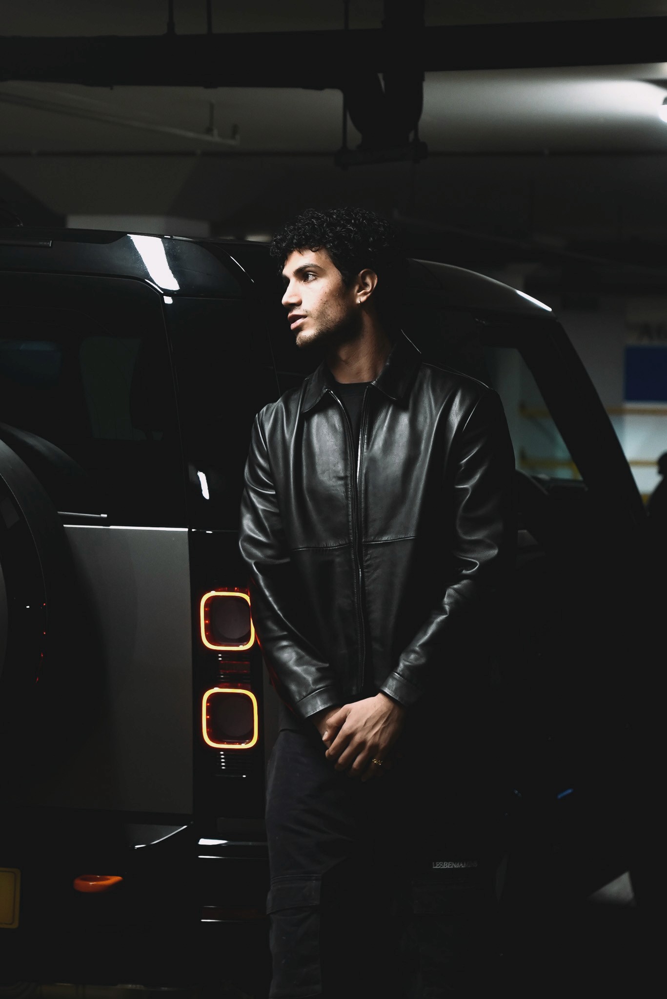 Woman hugging Shiba Inu dog, both looking at camera