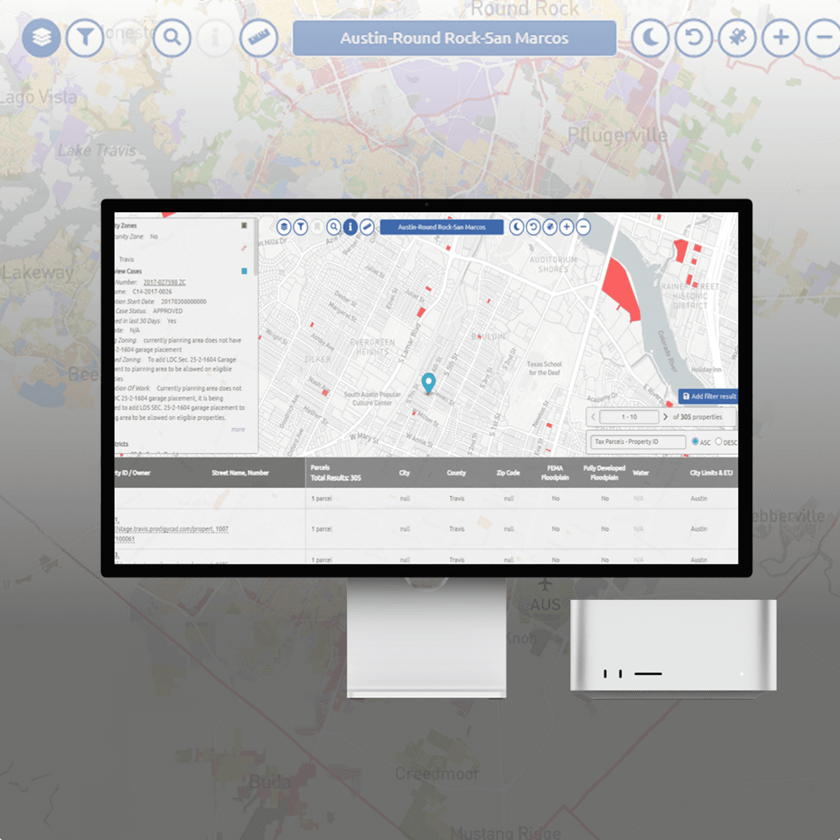 A large orange truck driving down a dirt road