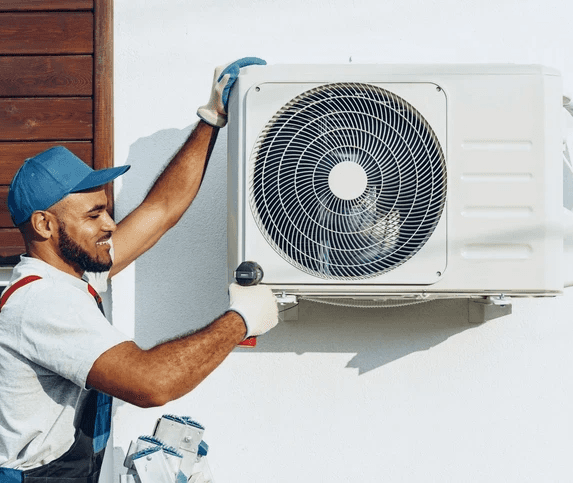 HVAC technician installing outdoor AC unit for residential HVAC services in Mississauga
