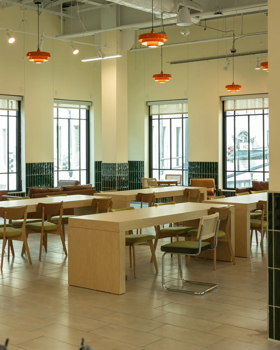 Second-floor third space at Azalea Fresh Market, designed for dining, studying, and community gathering.