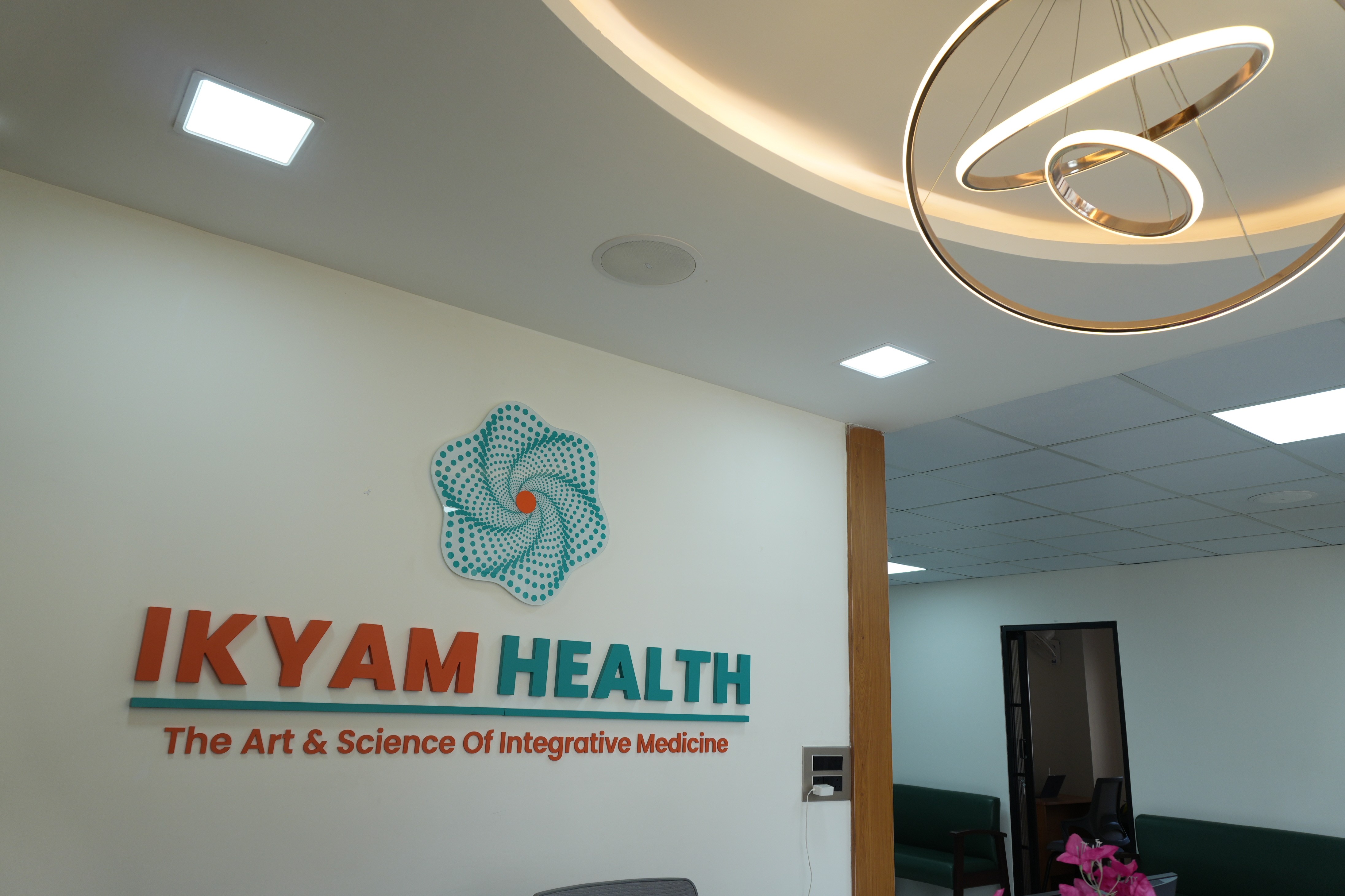 A surreal image of a person in motion, holding flowers in a field with a futuristic circular structure in the background.