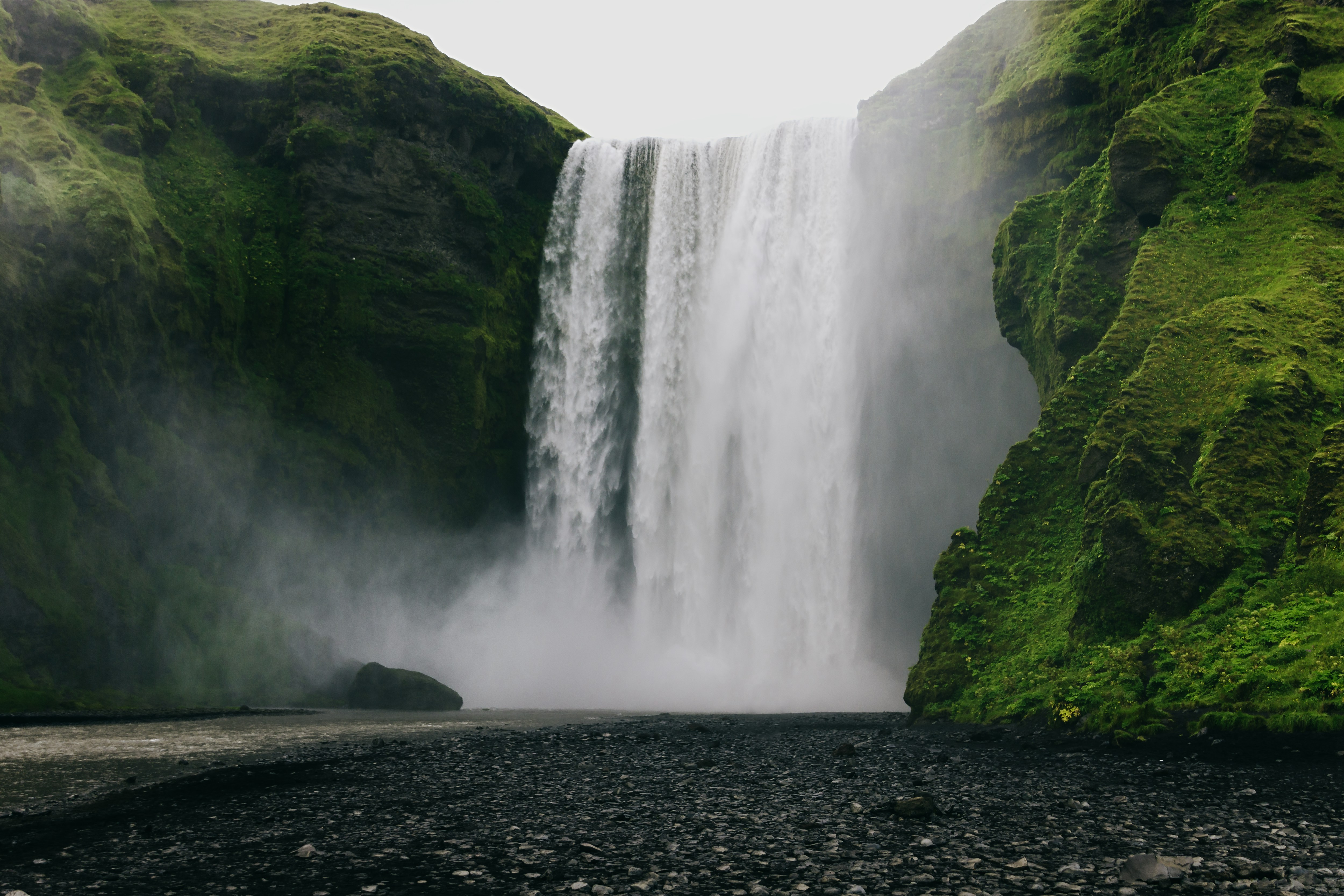 Skógafoss Waterfall with heavy mist rising at its base in South Iceland.
