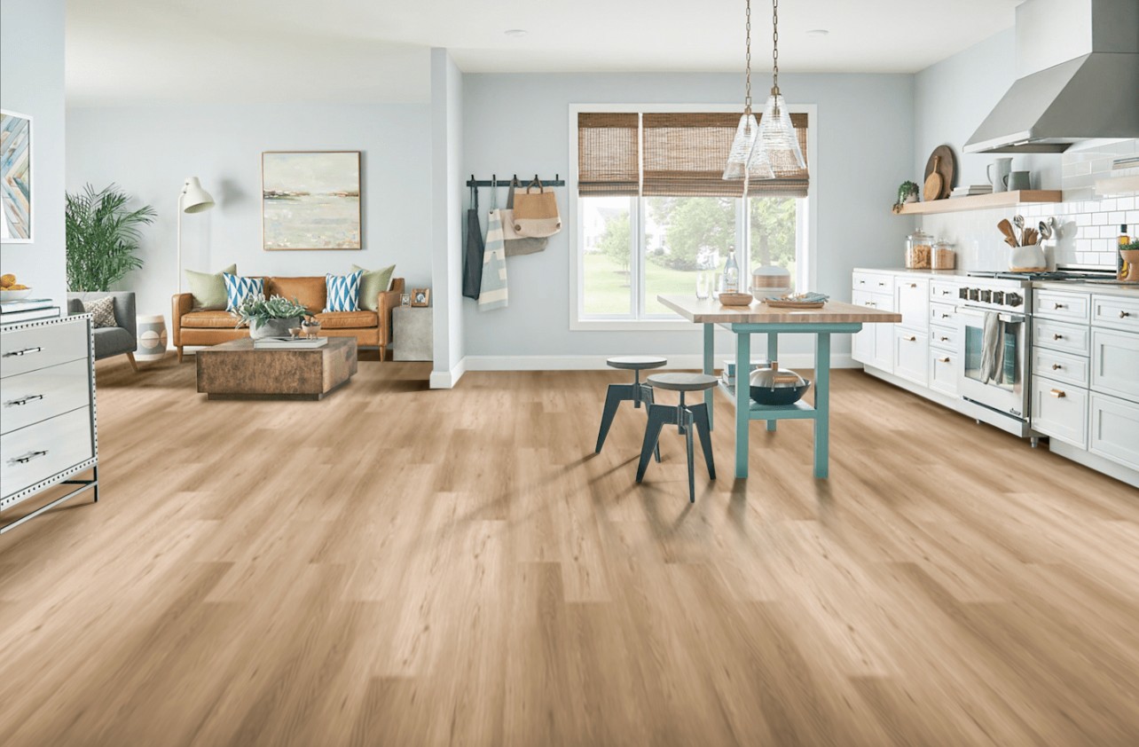 Bright open-plan kitchen and living area with perfectly level timber flooring in a Brisbane home — seamless finish that makes the whole space feel calm and balanced.