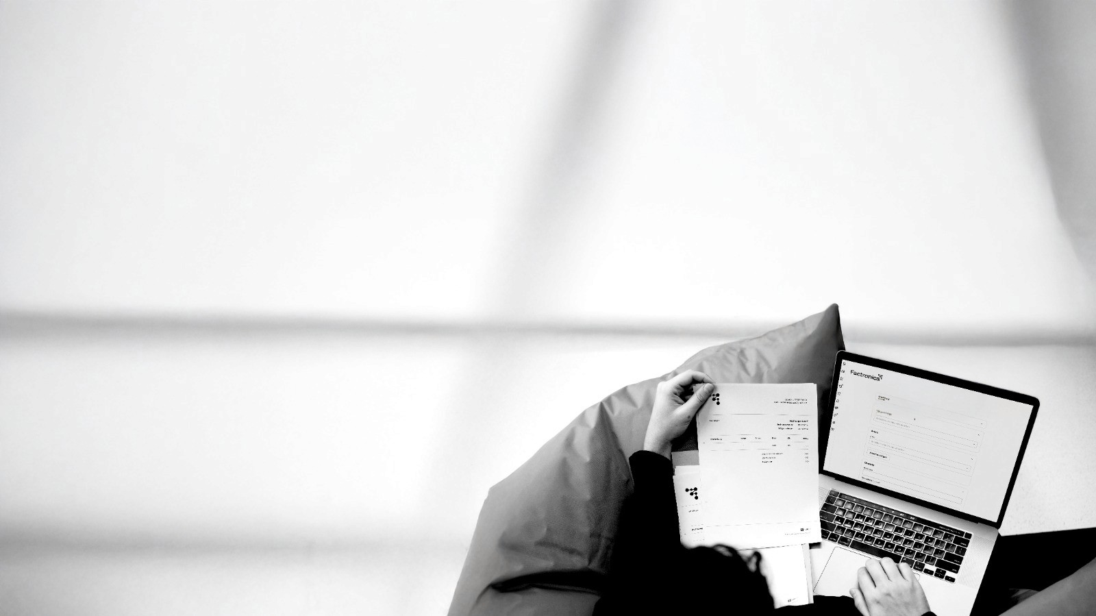 a laptop computer sitting on top of a wooden desk