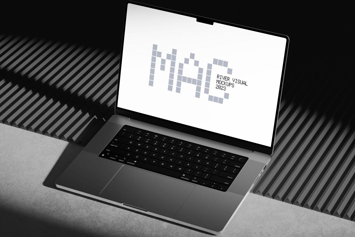 A modern MacBook mockup displayed on a dark surface with a vibrant blue corrugated background. The screen showcases a minimalist design, highlighting the device's sleek and professional build.