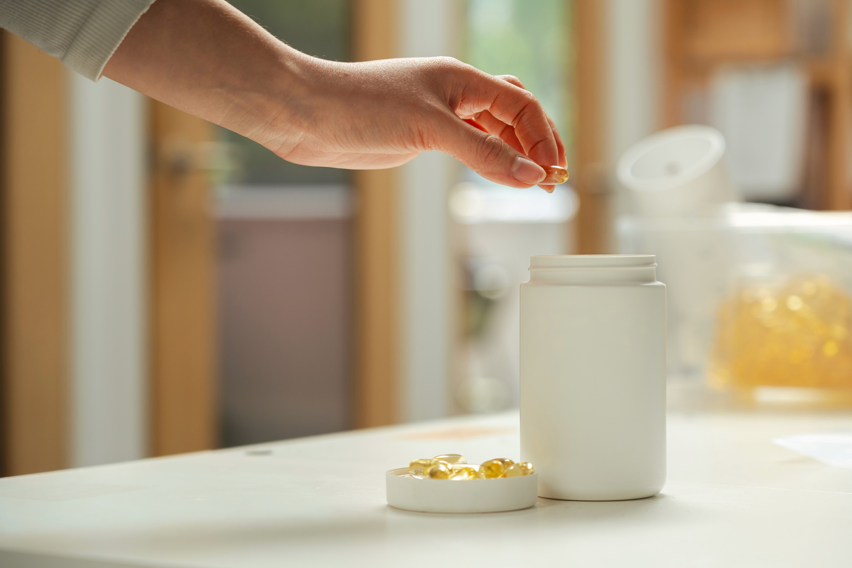 A lifestyle photograph of an open VIVOMER pill bottle containing capsules. This FDA-compliant packaging ensures a moisture-resistant and stable environment for nutritional supplements.