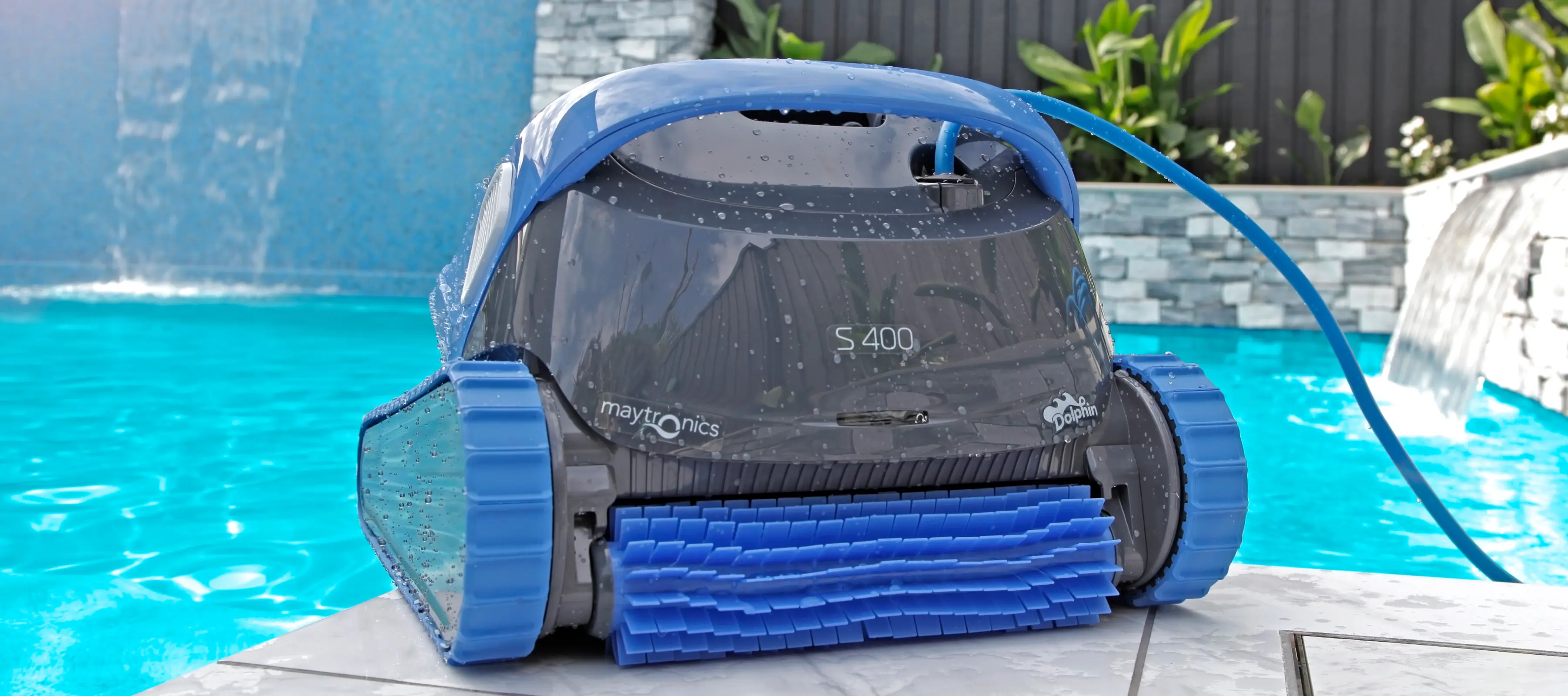 The dolphin s400 product shot next to a pool