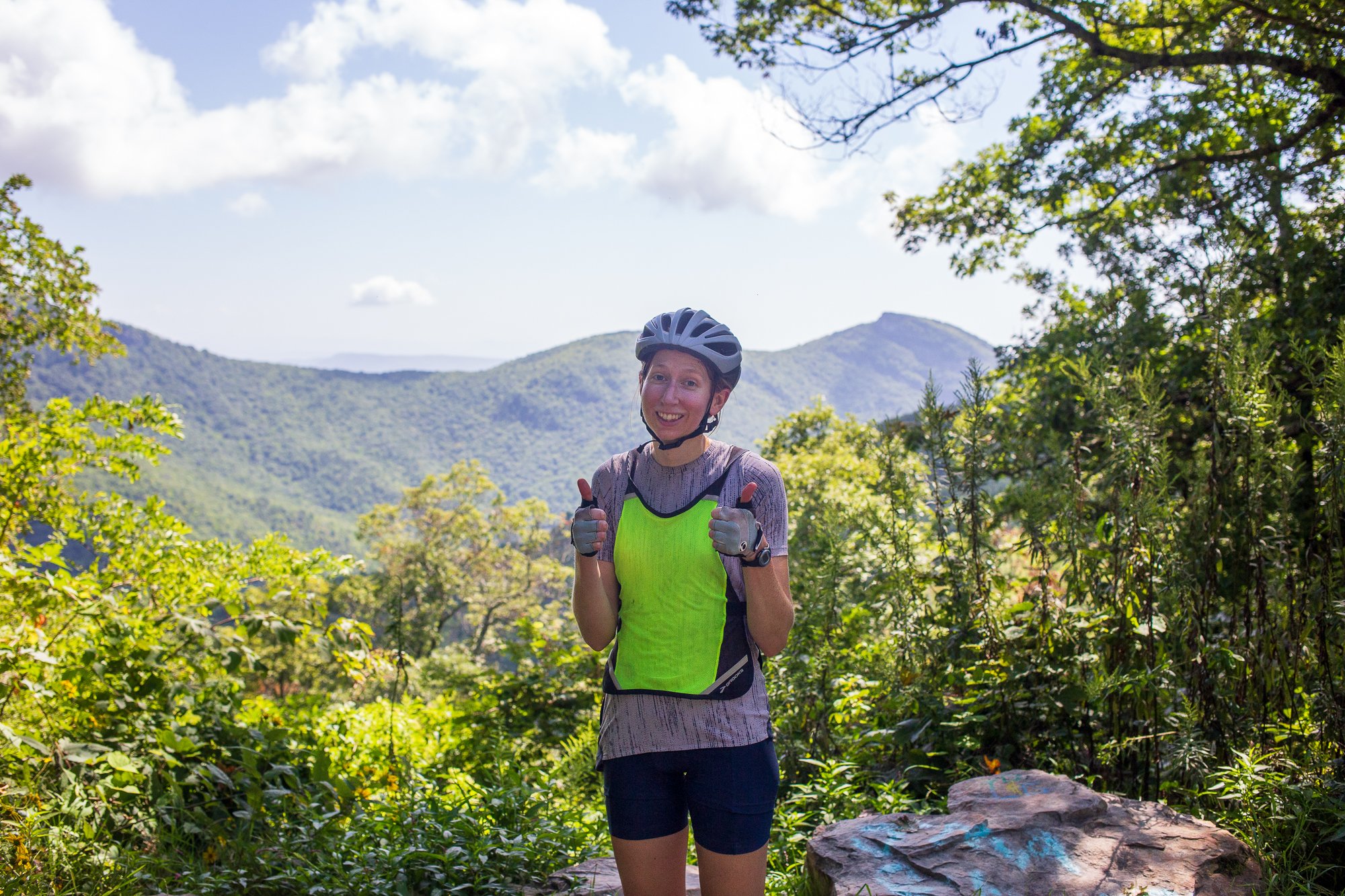 a row of Citibikes lined up in their docks on the side of a New York street