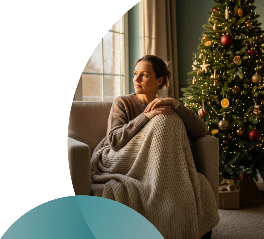 Couple cooking together in a bright kitchen while smiling at each other.