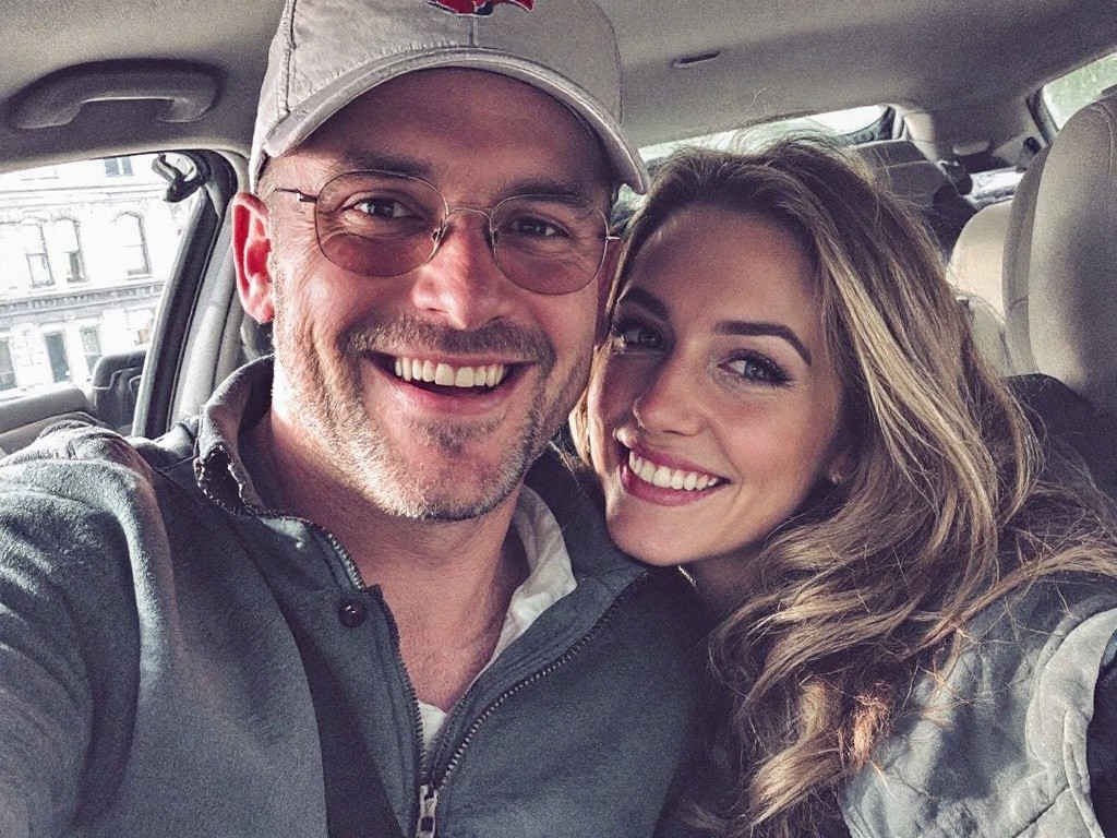 A selfie of a couple in a car