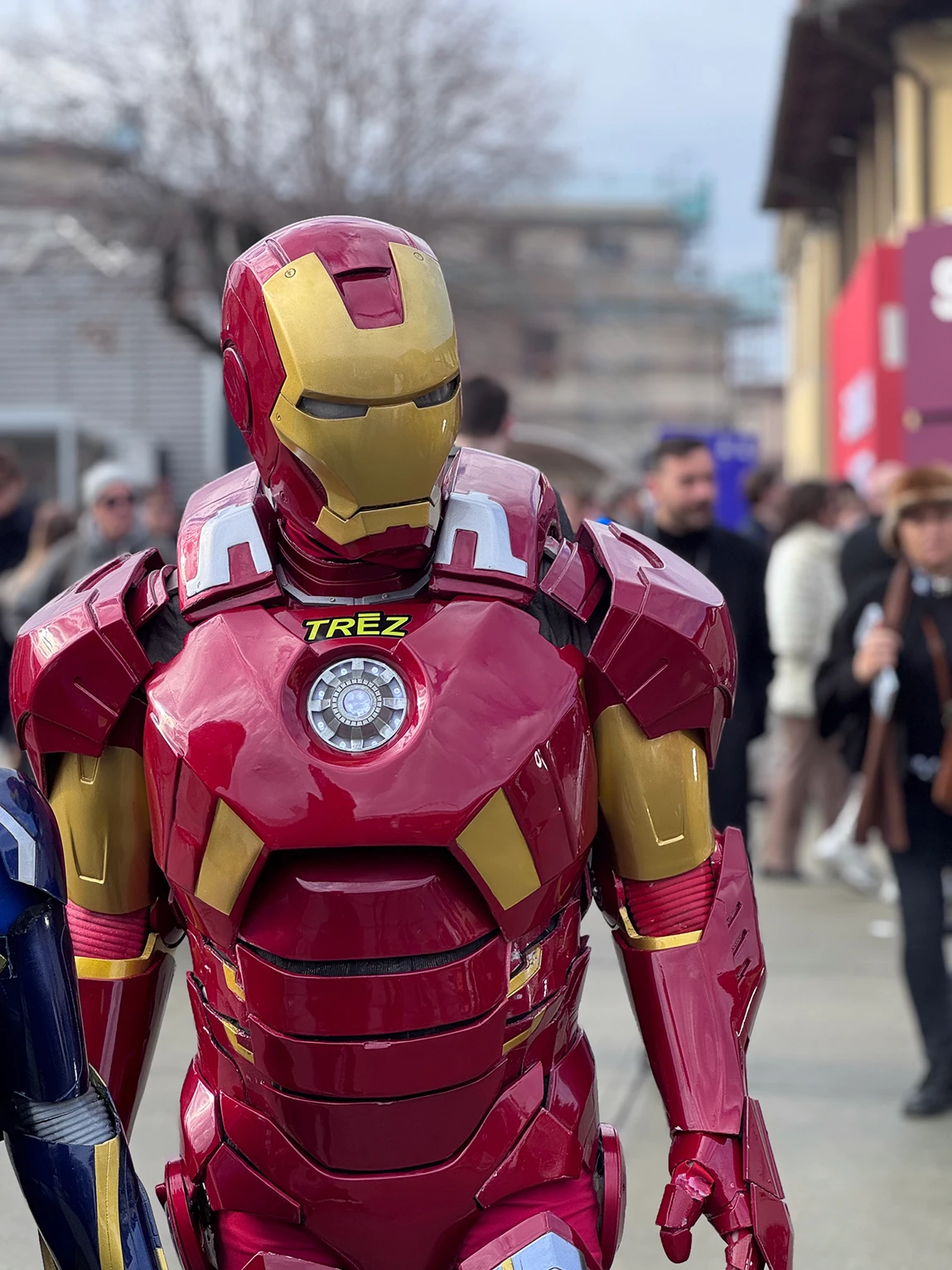 two womans wearing white jackets using the hood