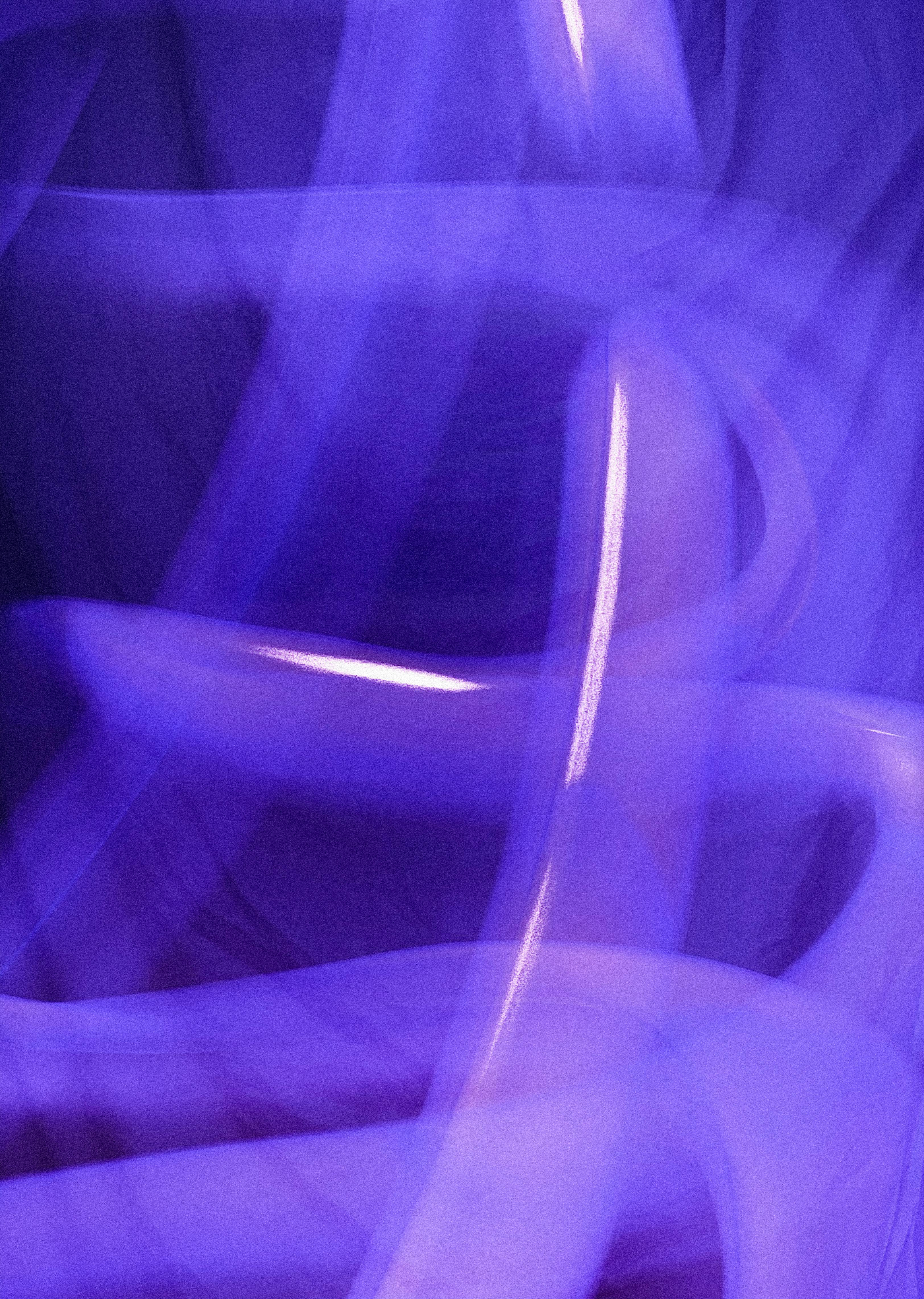 Blurred purple light streaks vertical frame