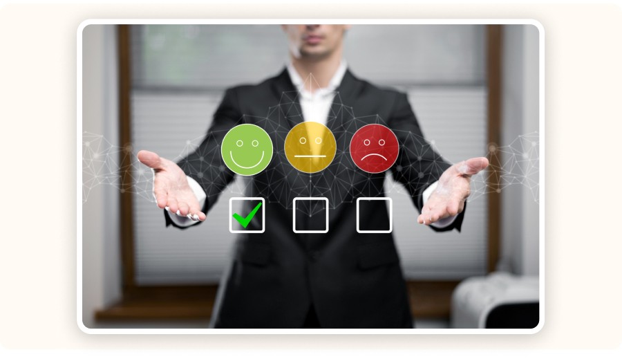 Businessman rating customer satisfaction with smiley icons