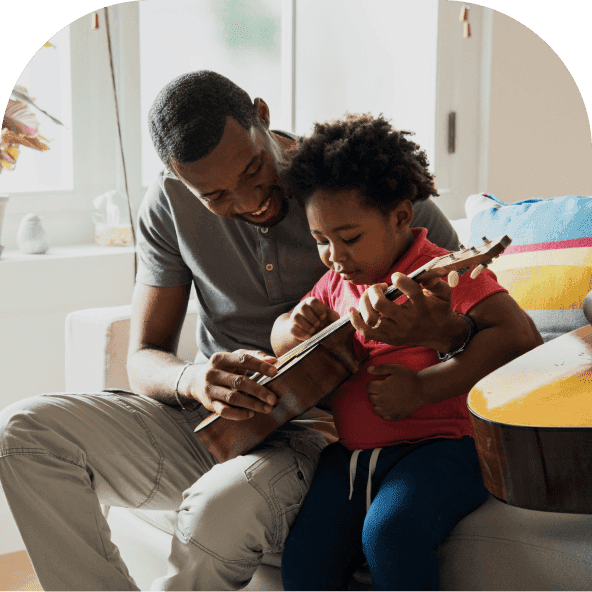 A father and son playing guitar