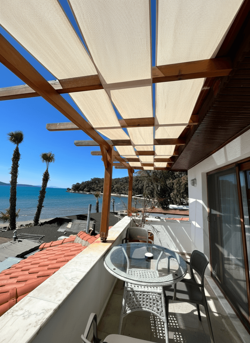 husband and wife working happily on a laptop