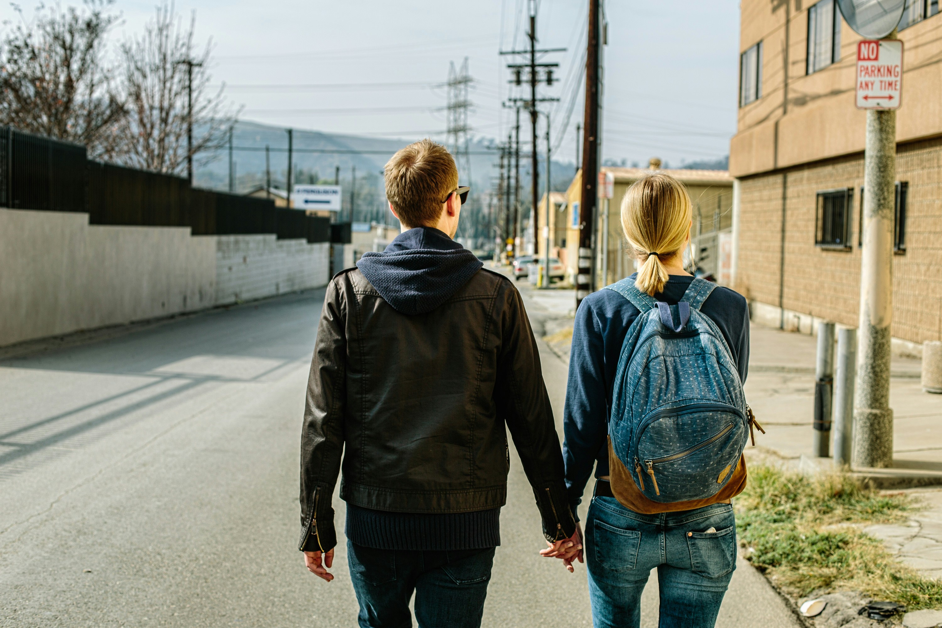 couple walking down the street - Fall Couple Outfits