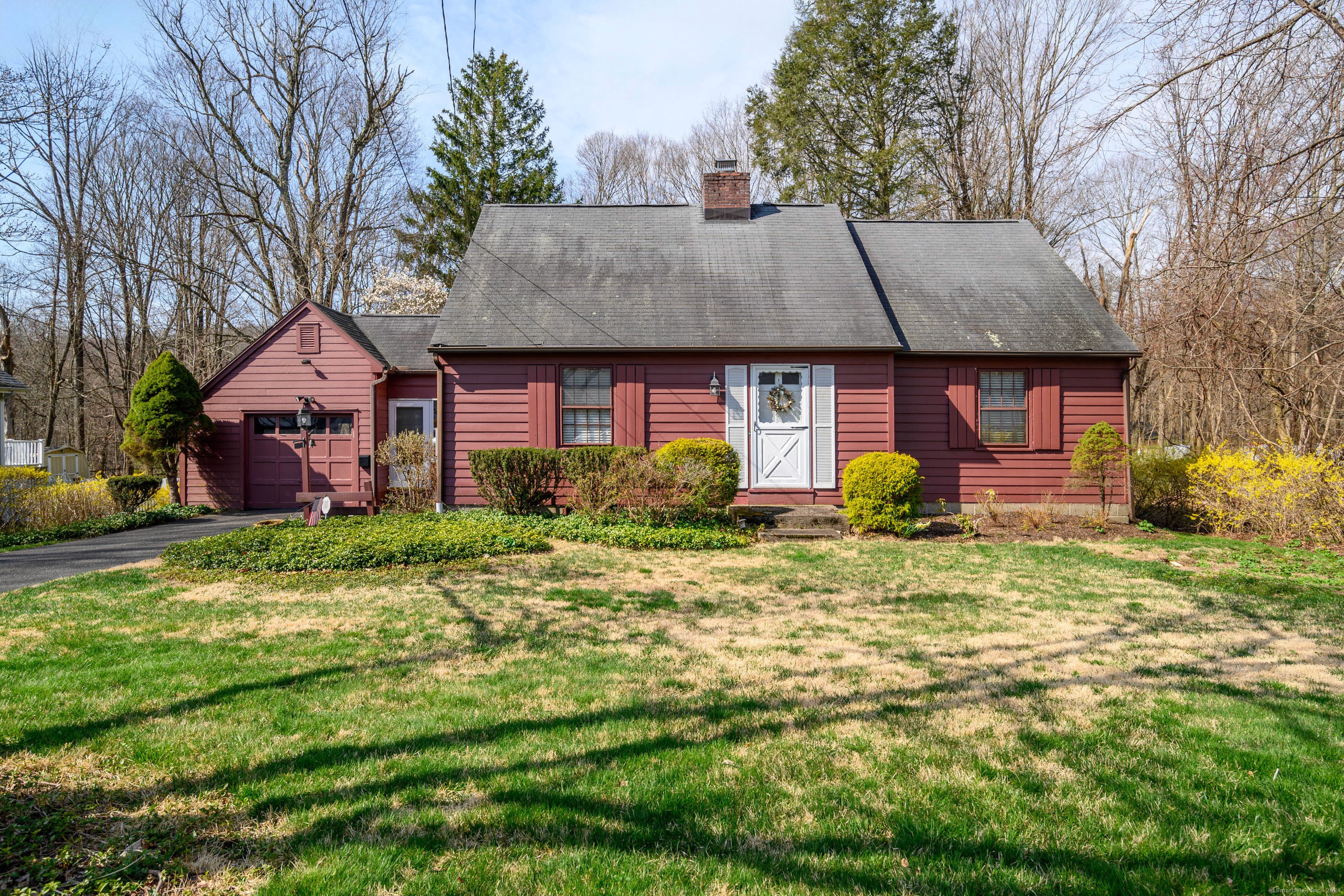 Red House with a grass yard