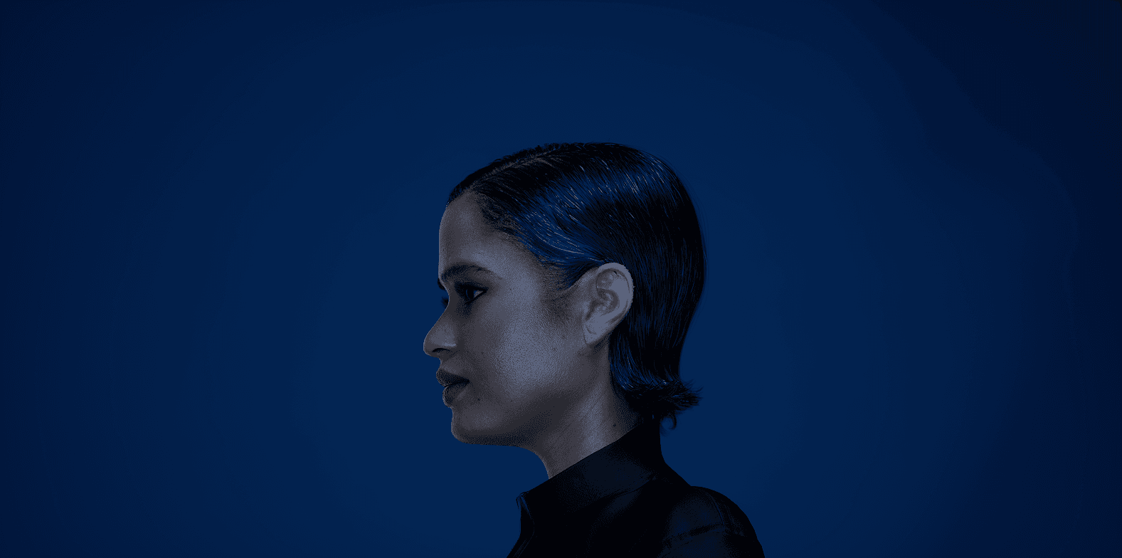 Close-up of white fur with black heart-shaped spots—soft, high-contrast texture for fashion/home décor.