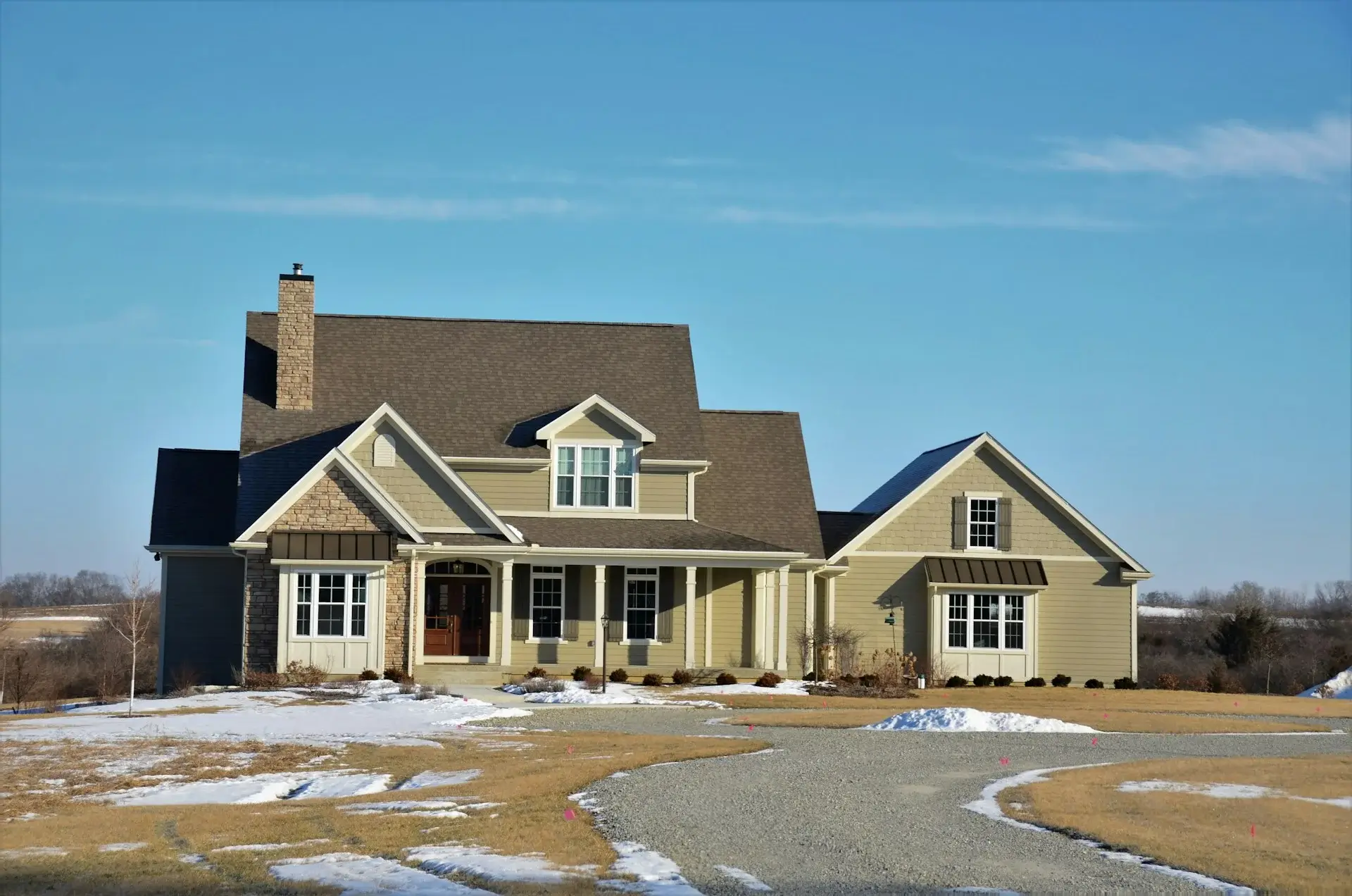 Large country-style house with porch.