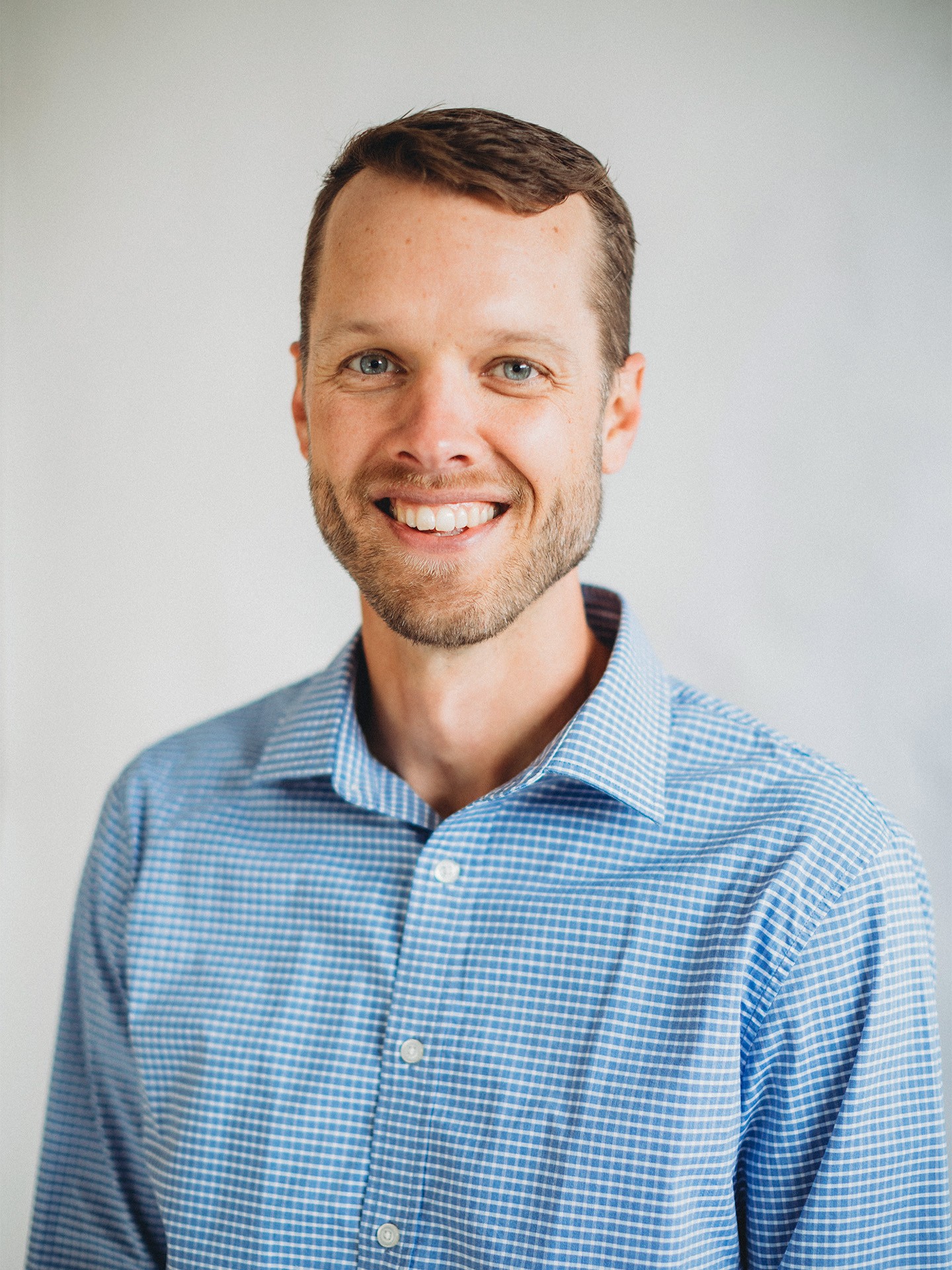 A medium-close portrait of Erik Wolgemuth smiling.