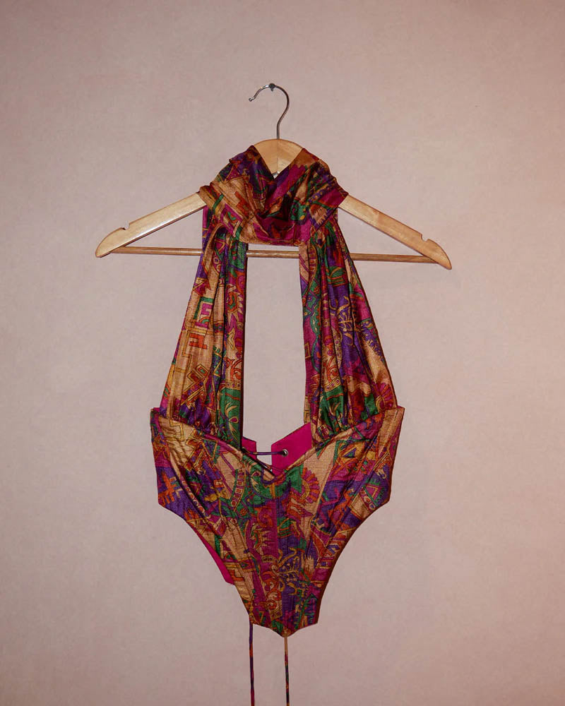 Vivienne printed silk tube corset made from vintage saree with open bustline, deep V-cut hips, and halter choker-style neckline.
