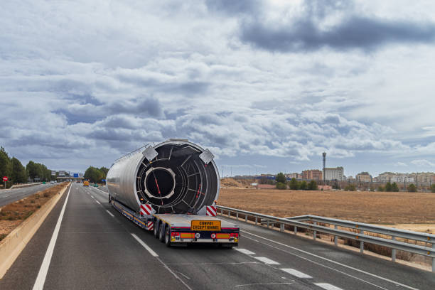 image of a flatbed truck transporting an oversized load